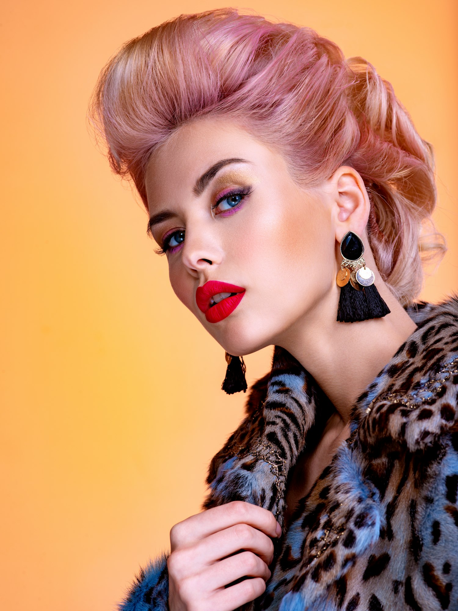 Beautiful woman with style hairstyle. White woman with bright colored makeup.